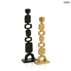 Karakteres fekete gyertyatartó aszimmetrikus, totemszerű formával, aranyszínű gyertyatartóval, elforgatva