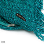 Hosszúkás, akvakék színű, rojtos szélű pamut díszpárnahuzat sarok nagyítva