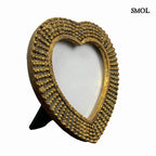 Antik arany szív képkeret gyöngyös díszítéssel és vintage textúrával, elfordítva