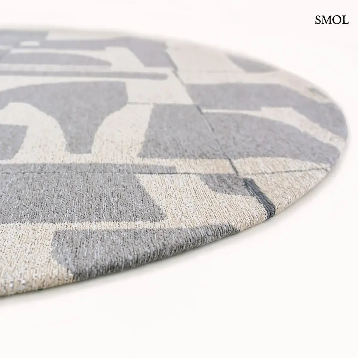 ECO RUG STRING barna-szürke geometrikus mintás szőnyeg, Bauhaus ihletésű, vágott formákból építkező minta, kerek formában, nagyítva