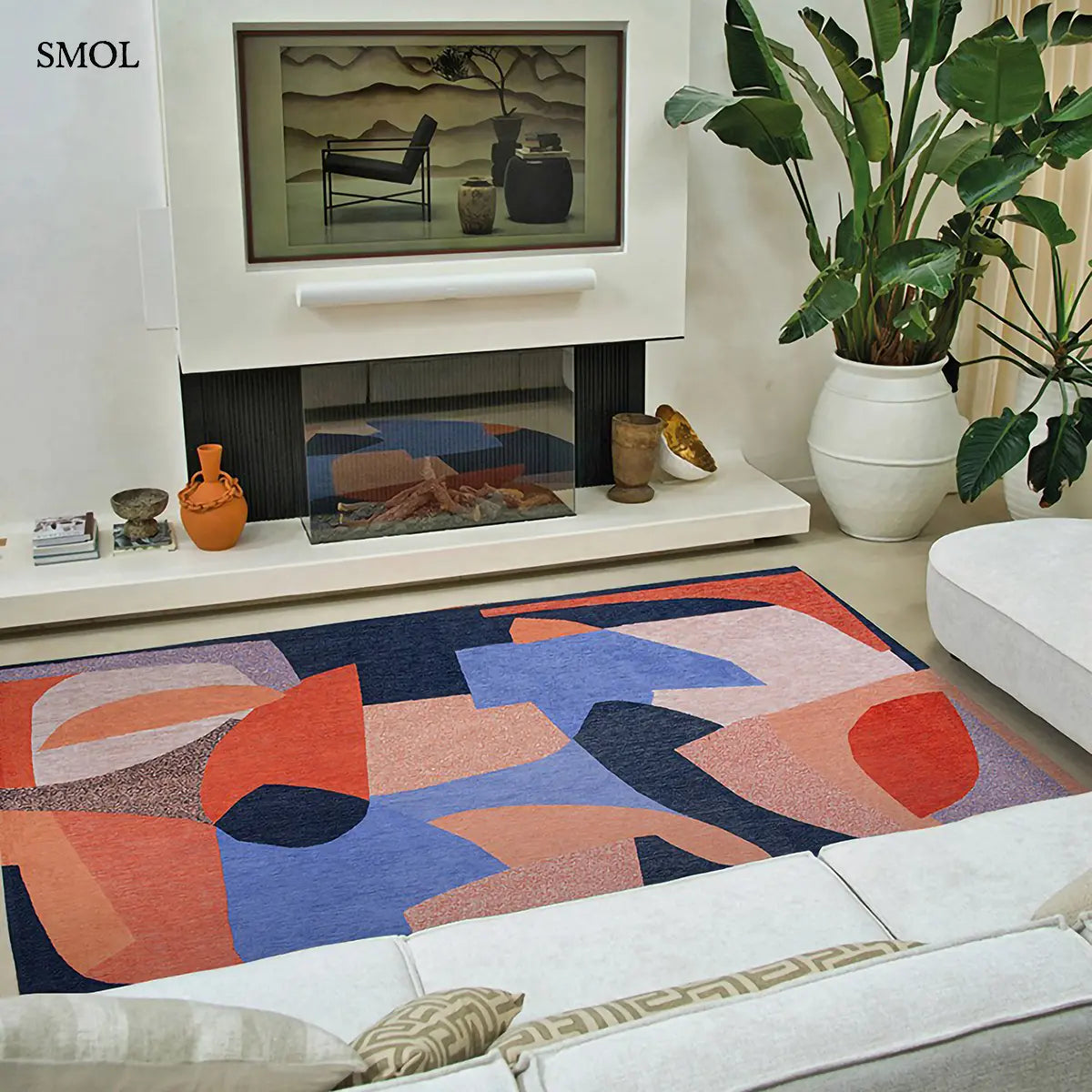 ECO RUG CARPE DIEM sokszínű geometrikus szőnyeg absztrakt összefonódó formákkal, nappaliban, kandallóval