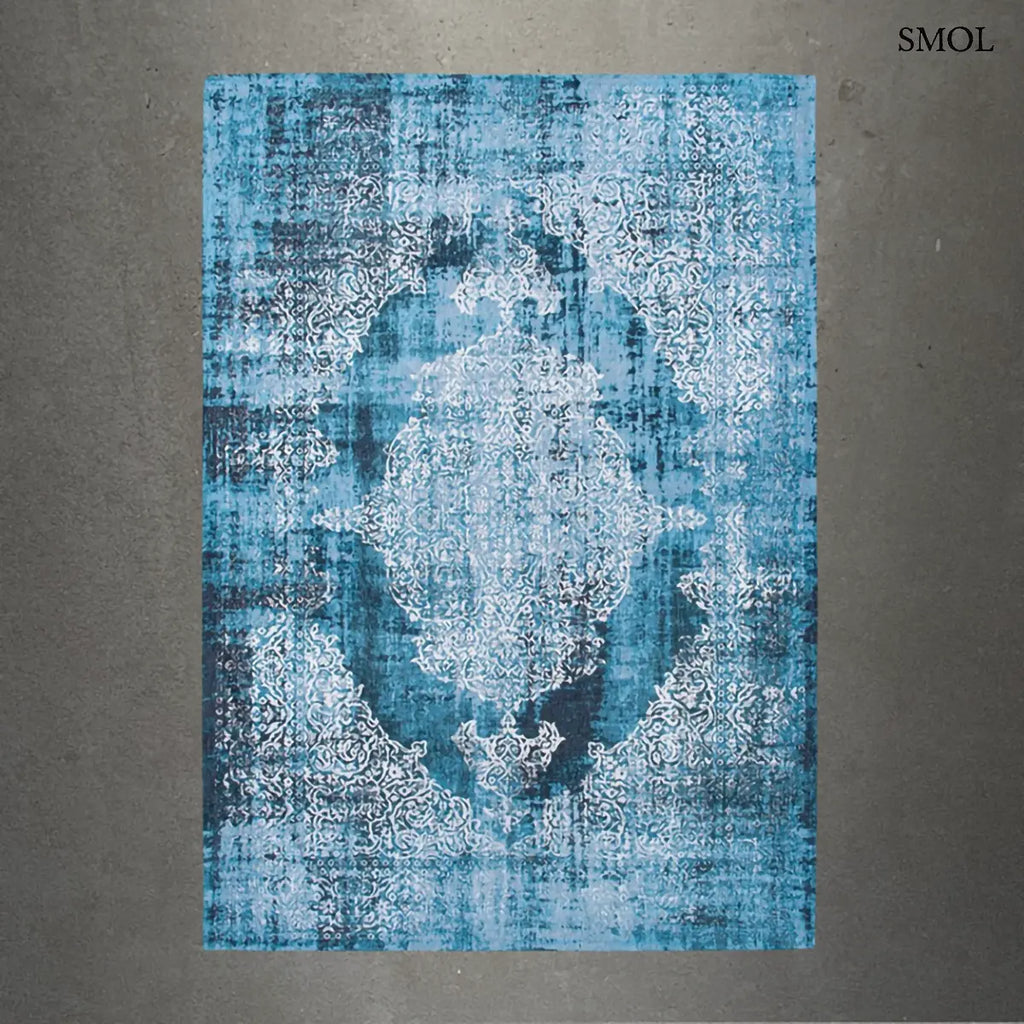 ECO RUG STORM medaillon mintás szőnyeg kék tónusokban, vintage hatással, foltos vízfestmény felülettel, szürke háttérrel