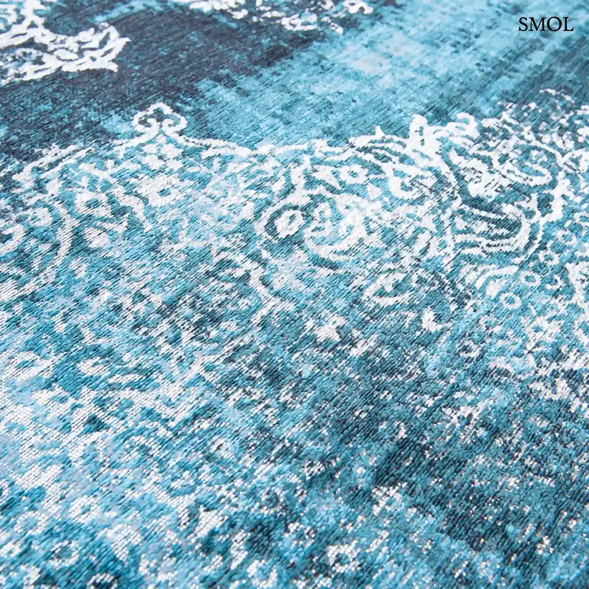 ECO RUG STORM medaillon mintás szőnyeg kék tónusokban, vintage hatással, foltos vízfestmény felülettel, nagyítva