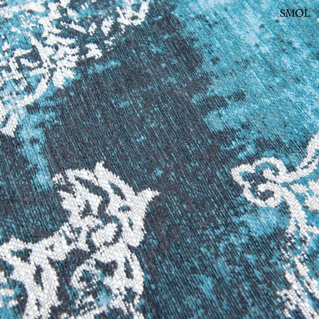 ECO RUG STORM medaillon mintás szőnyeg kék tónusokban, vintage hatással, foltos vízfestmény felülettel, minta nagyítva
