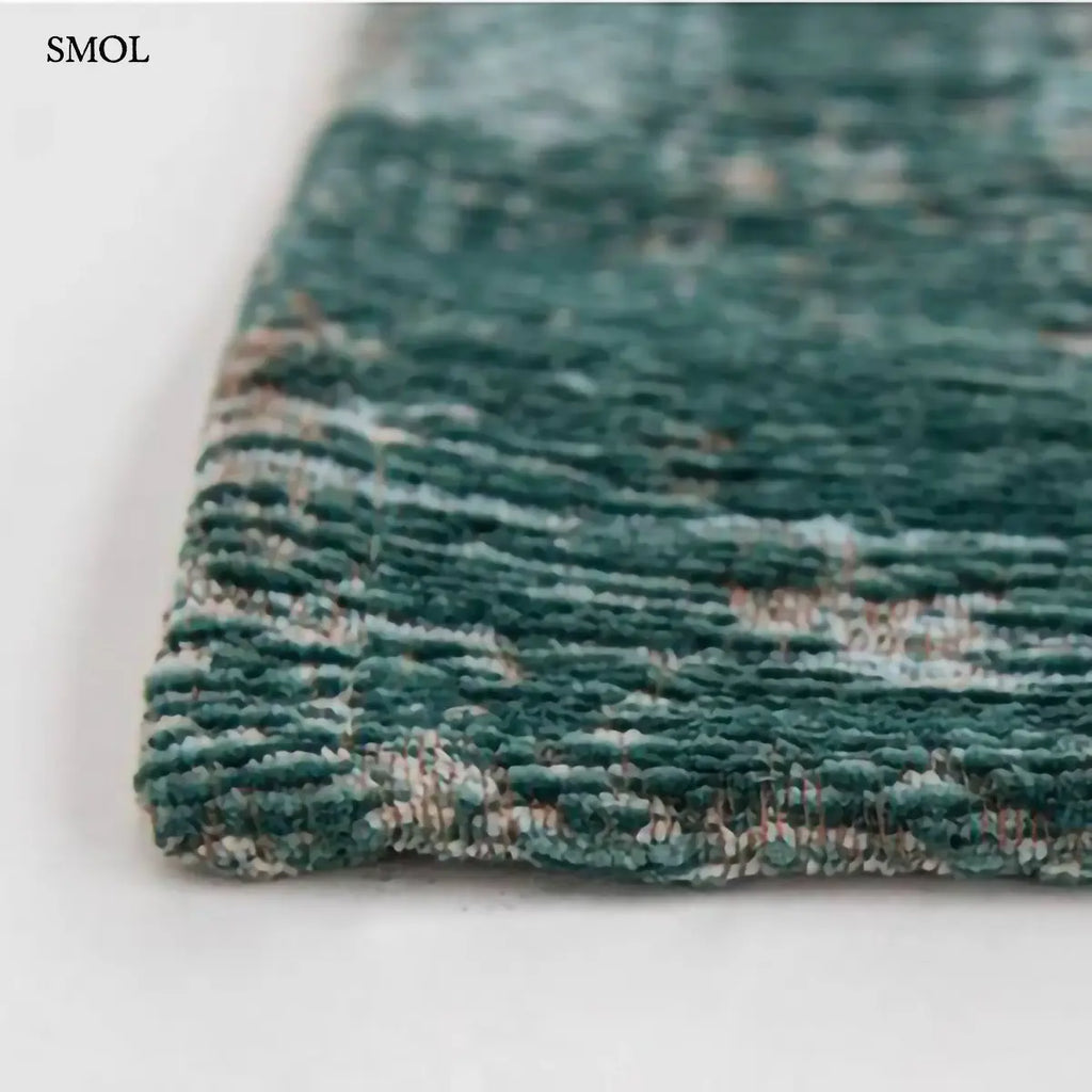 ECO RUG JADE perzsa mintás szőnyeg jadezöld alapon krémszínű koptatott medallion mintával, vintage hatással, jacquard szövés, sarok nagyítva