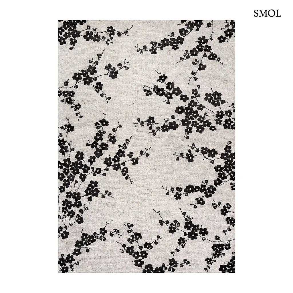 ECO RUG NIGHT SNOW sakura mintás szőnyeg világos alapon, fekete cseresznyevirág motívumokkal, fehér háttérrel