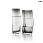 Függőlegesen elrendezett, három kocka alakú sötétszürke üveg váza, két méretben