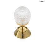 Sárgaréz talpú, kristályhatású, fazettált üveg búrával ellátott, hordozható, tölthető LED asztali lámpa felülről