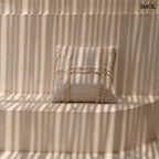 Boho pamut párna natúr színben, kagylómintás díszítéssel - teraszon