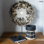 Fekete terracotta gyertyatartó kézzel font natúr rattan díszítéssel, M-es méretben, könyvvel, és szemüveggel