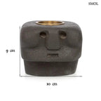 Kézzel faragott fekete kő mécsestartó misztikus arc szobor formában, sárgaréz betéttel, méretekkel