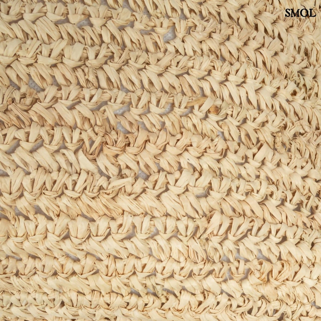 Natúr színű, kézzel szőtt raffia díszpárnahuzat boho stílusban textúra nagyítva