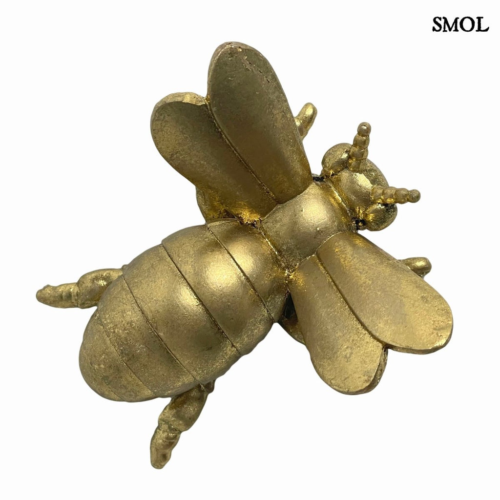 Elegáns sárgaréz színű méhecske figura polirezin anyagból, felülről, ferdén